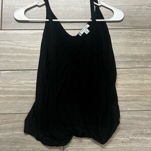 Black tank with flowy front. Perfect to hide your midsection.